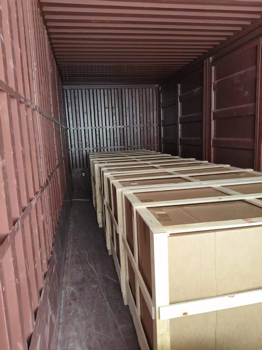 Wooden pedicure chair crates arranged inside a shipping container