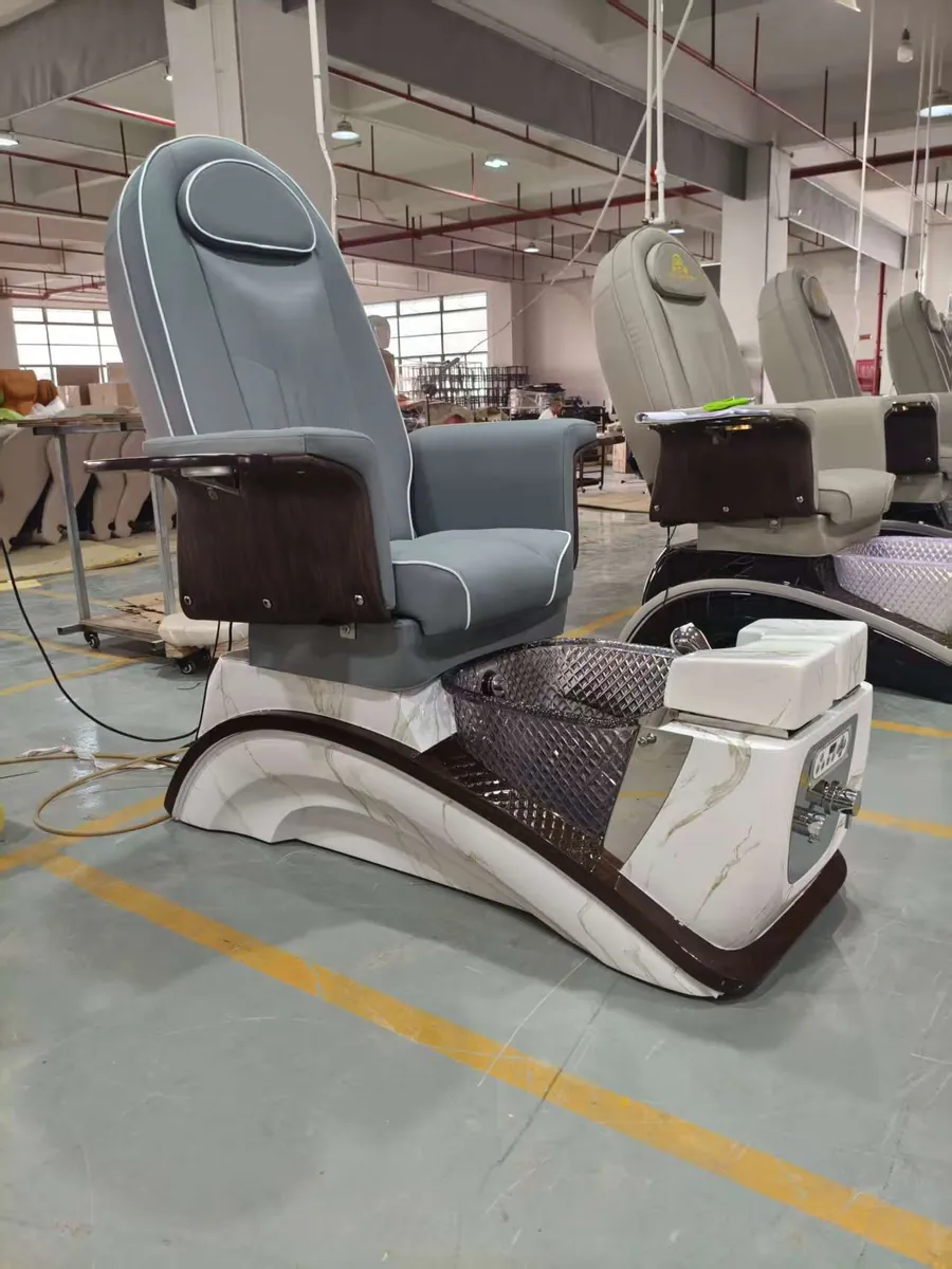 Blue-gray-upholstered PC-50 pedicure chair photographed in the workshop